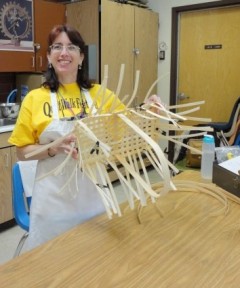 Monica is weaving the first row