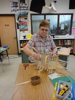 Linda is weaving the rows of her basket